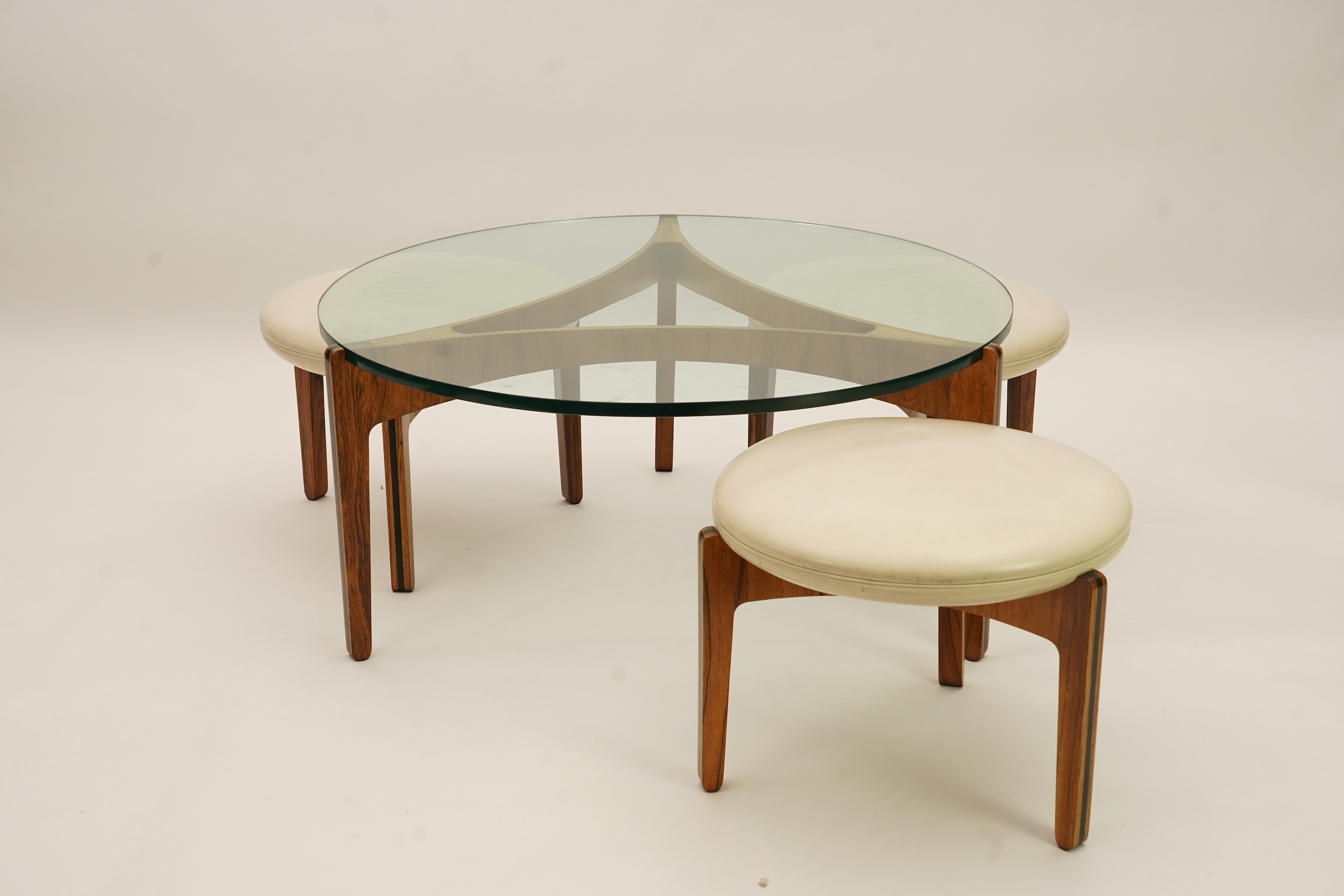 Sven Ellekaer (Danish, 1926-1984) for Christian Linneberg Møbelfabrik: A coffee table and three nesting stools ensuite